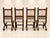 Four superb Neo-Renaissance style chairs in solid carved walnut, testaments to the high-quality joinery of the last third...