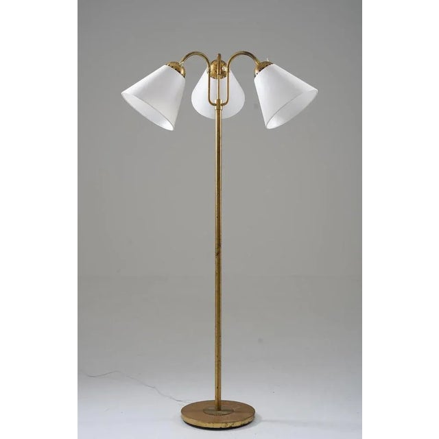 Presenting a captivating Swedish Modern floor lamp from the 1940s, expertly manufactured by Böhlmarks. This exquisite...