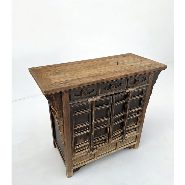Retrieved from Shanxi Province in Northern China, this beautifully aged 17th century cabinet is made from solid elm using...
