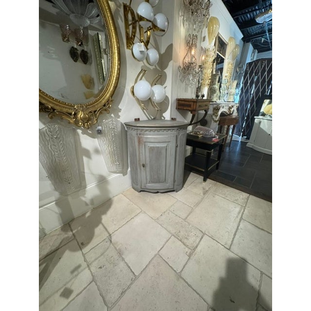 The 19th c. Swedish Painted Corner Cabinet is a unique and charming piece of furniture that would make a lovely addition...
