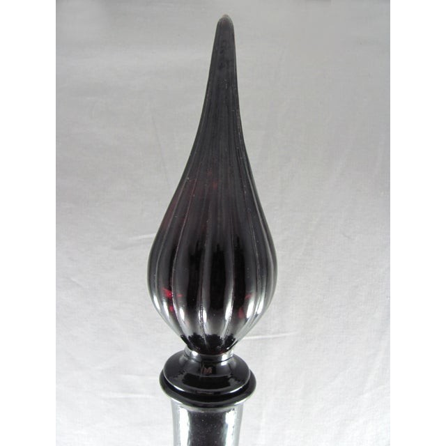 26" tall from top of stopper to base, 4-3/4" diameter at base Decanter and stopper No chips nor cracks Dark purple
