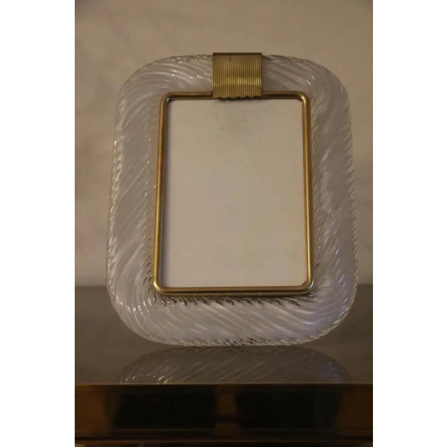 This beautiful vertical photo frame is purely in the vénitien glass manufacturing tradition.The technique used to get this...