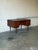 This double pedestal executive desk features six drawers alongside a drop-down cabinet on the reverse side. Sculpted lip...