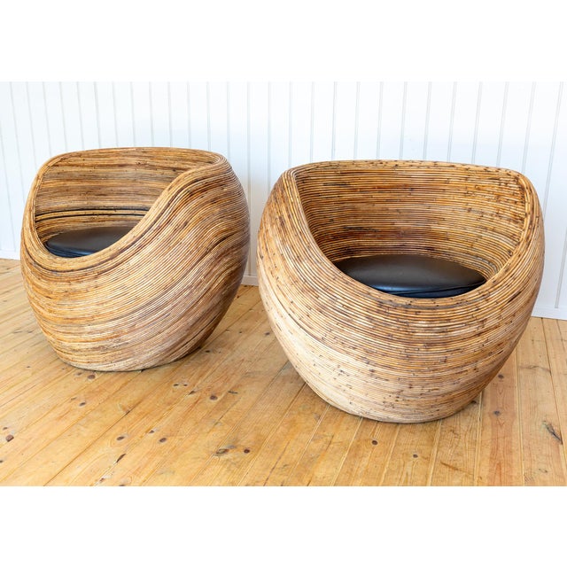 A strikingly impressive pair of sculptural pod armchairs in lovely vintage condition. This super-stylish pair would suite...