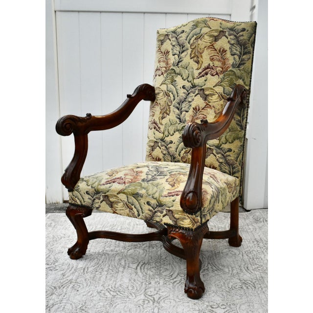 Vintage (1950's) High Back Arm Chair has a Renaissance Revival Style. The Frame is Wood. Carved Wood. Tapestry Like...