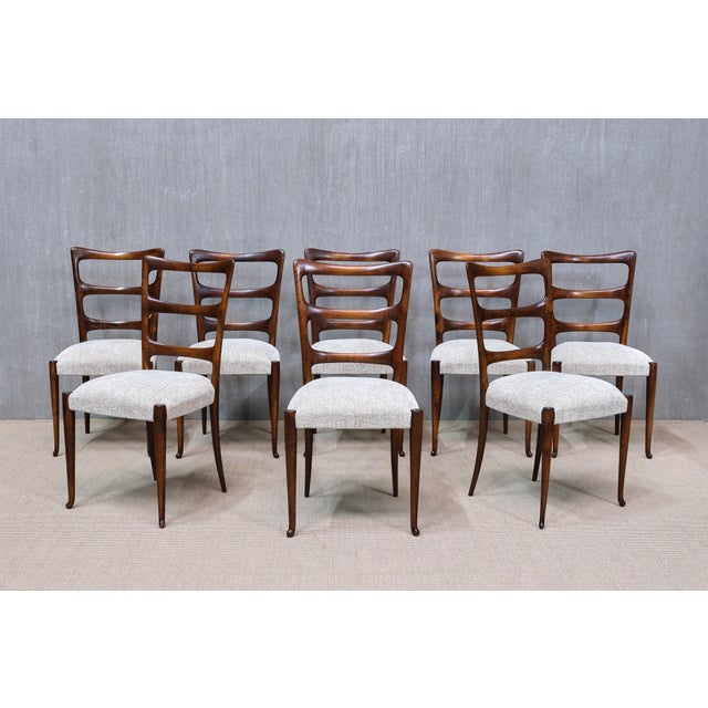 This exceptional set of eight dining chairs was designed by Paolo Buffa and made in Italy from the late 1940s. They are...