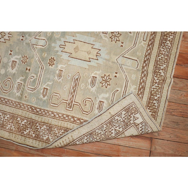 An early 20th Century Decorative Perpedil rug in soft green and cream