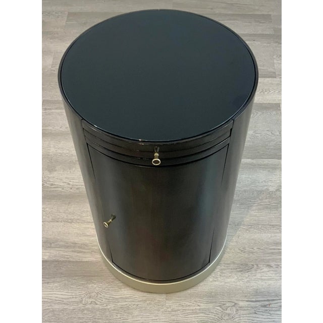 Original Retail $970, stylish Caracole Modern Loft Round Side Table, dark wood, silver finished accents, storage space,...