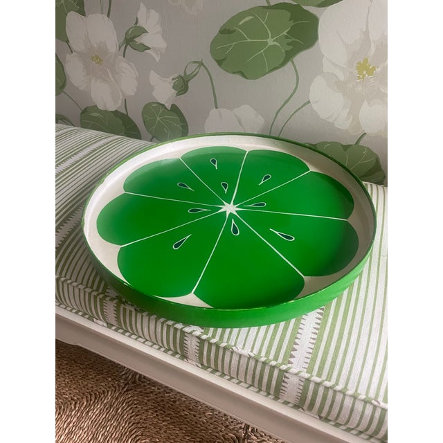 Great drinks tray in the form of a giant lime slice. It is a painted slice over wood base. Perfect for those summer...