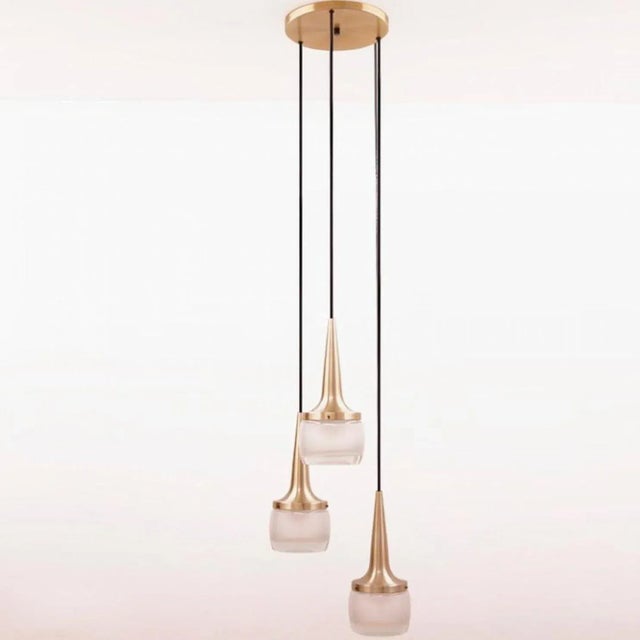 This elegant cascade light was manufactured by staff leuchten in germany. The light is executed in brassed aluminium and...