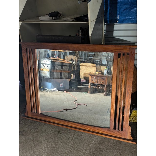 This substantial vintage wall mirror is a true statement piece! The bold, solid wood frame features a rich, warm brown...