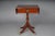 20th Century English Side Table, Mahogany This yew side table is a classic English design. It features a drop-leaf top,...