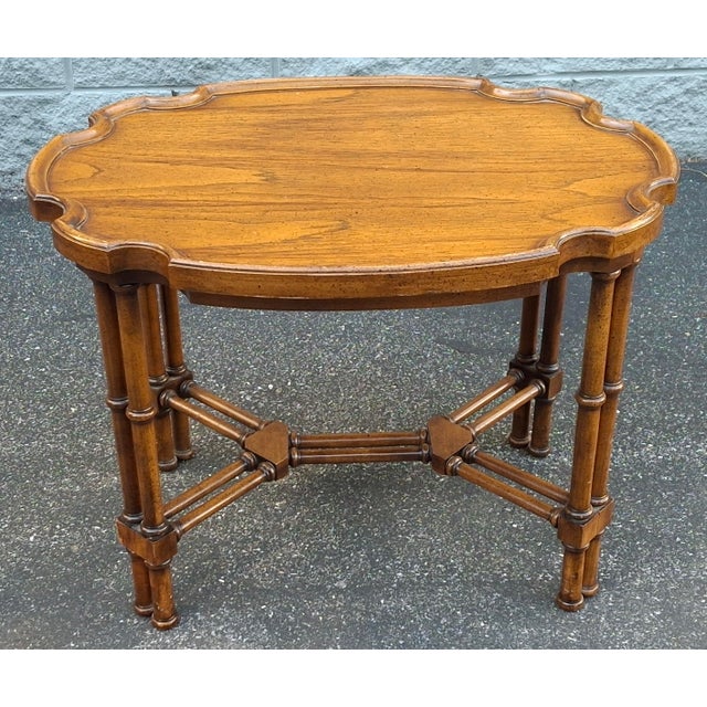 Brandt Furniture Regency Style Fruitwood Faux Bamboo Side Table with Stretcher and Scalloped tray top. Measures 28" in...
