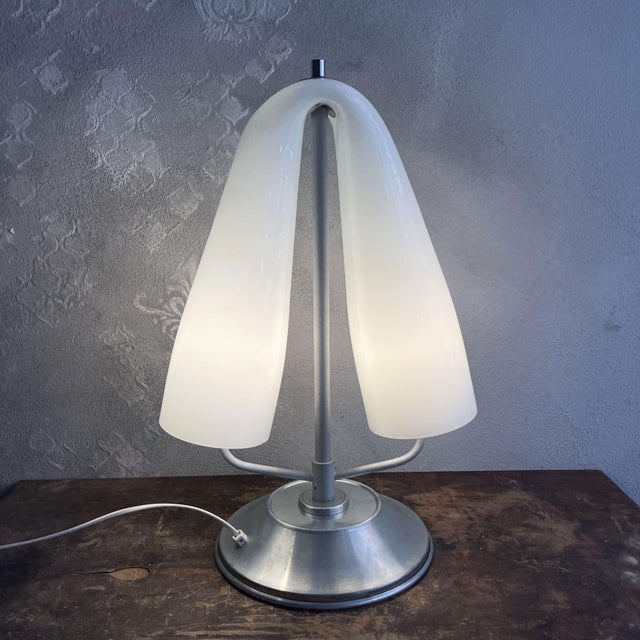 This 1980s table lamp faithfully embodies the space age style. Attributed to the historic mazzega glassworks, it is a...
