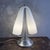 This 1980s table lamp faithfully embodies the space age style. Attributed to the historic mazzega glassworks, it is a...