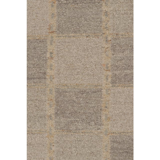 Handwoven in high quality wool, this 9x12 Scandinavian flat weave explores geometry through a subtle checkered grid with...