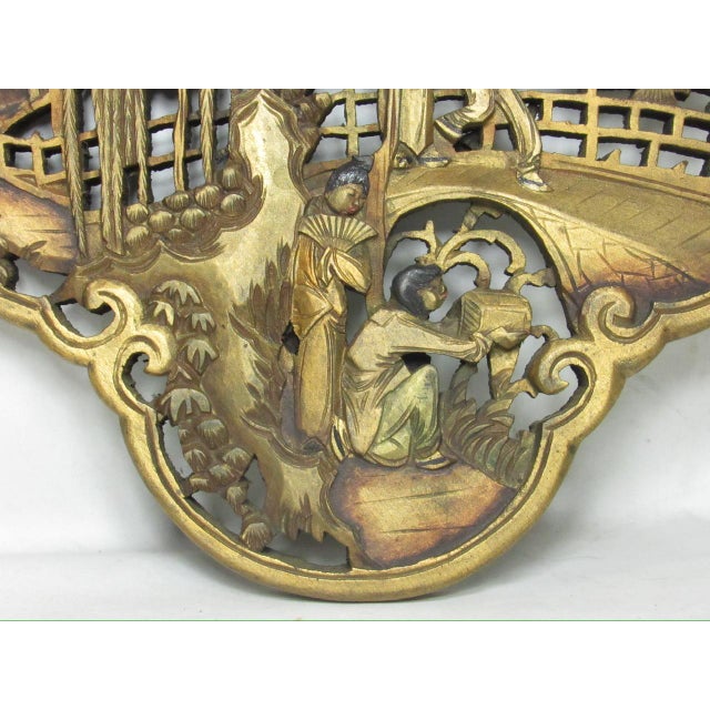 Chinese giltwood carved wall hanging panel, c.1950’s All hand carved showing figures in a garden with houses in the...