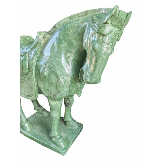 Absolutely immense Taiwanese Jade Saddled Tang War Horse Sculpture. Measuring at 31" long, standing 23" high and 8" deep,...