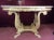 Beautiful and elegant carved table with marble top, made in Italy. Top sits on base but is not connected, which makes it...