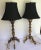 Pair of antique lamps from Morocco with gold gilding and accents of small mirrors throughout. Standing on tri pod pedestal...
