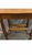 A beautiful 1900‘s library table/desk with fluted cabriole legs and a sled shelf on the bottom. The motif is an acanthus...