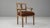 This 19th-century French Neoclassical oak armchair exemplifies refined craftsmanship and timeless elegance. The carved...