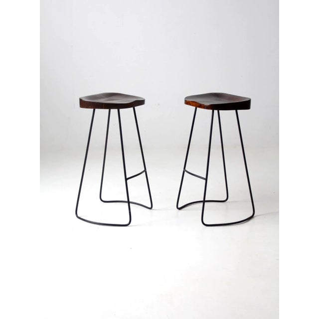 Wood Pair of Vintage Sculpted Wood Saddle Seat Bar Stools With Black Iron Bases For Sale - Image 7 of 11