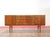 This mid century modern vintage sideboard credenza by Beautility is a stunning piece crafted from teak wood, showcasing...