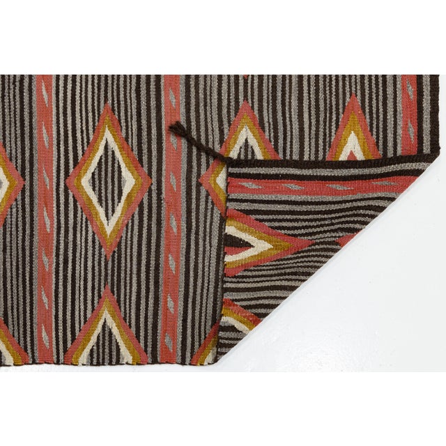 Elevate high-end interiors with this striking contemporary wool rug, featuring a refined modern interpretation of...