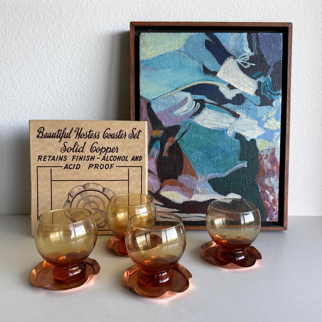 Here we have for you a darling piece of mid-century entertaining. This is a set of four matching solid copper coasters,...