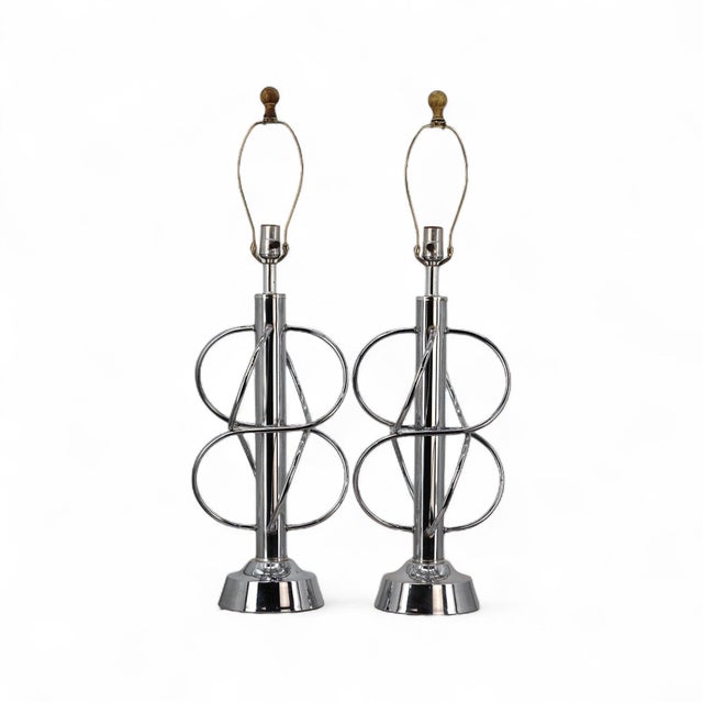 A bold statement in atomic-era design, this pair of vintage chrome table lamps channels the energy and optimism of mid-...