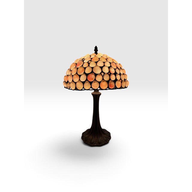 Striking vintage handcrafted seashell table lamp in the manner of Richard Hoosin, featuring a dramatic domed shade...