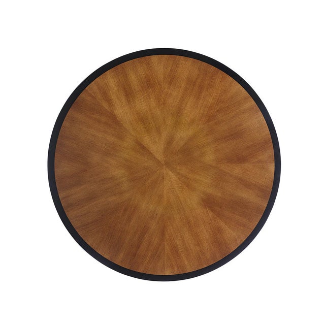 Modeled after a Biedermeier table that Bunny found at a flea market, this handsome table has been given a light mahogany...