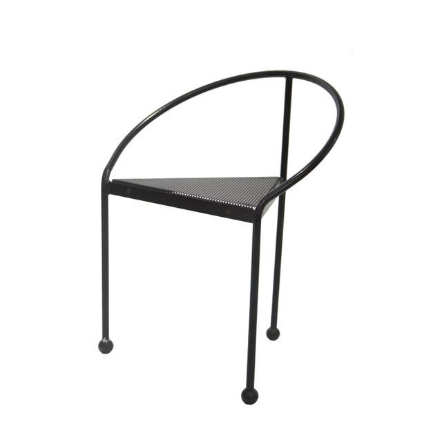 Tripod chair composed of a black lacquered iron structure with a micro-perforated sheet for the seat. 11 units available....