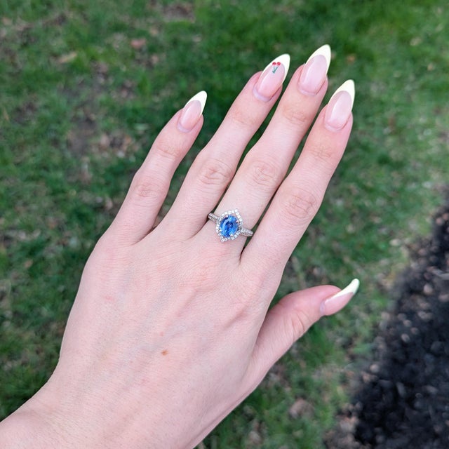 Stunning is an understatement for this ring! The all natural earth mined diamond halo and accents perfectly emphasize the...