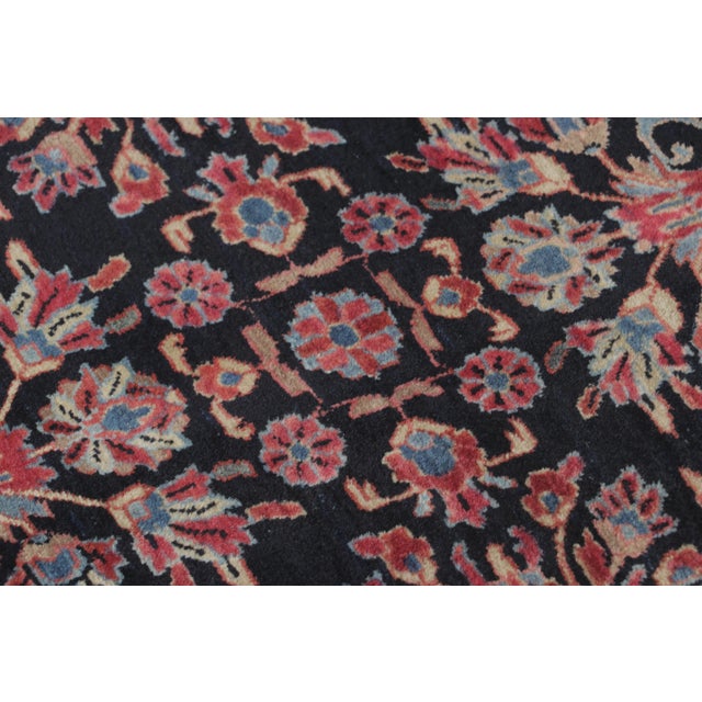Hand-knotted in wool and originating circa 1920-1929 from Persia, this antique 2x3 gift-sized Persian Sarouk rug joins Rug...