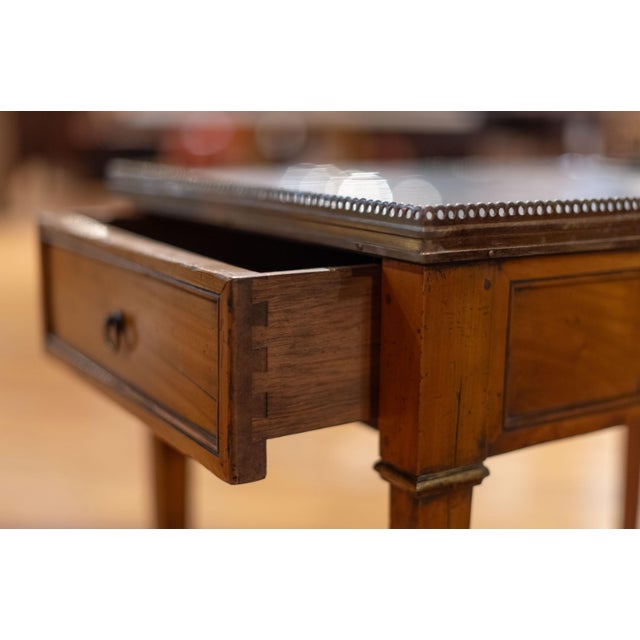 Functional French wine table, marble top, two chillers fitting wine bottles, one drawer, all on tapered legs. Circa: 1860