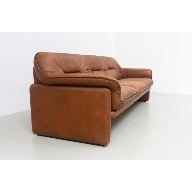 Gorgeous DS16 De Sede sofa in perfect patinated caramel colored buffalo leather. This iconic 3-seater sofa was...