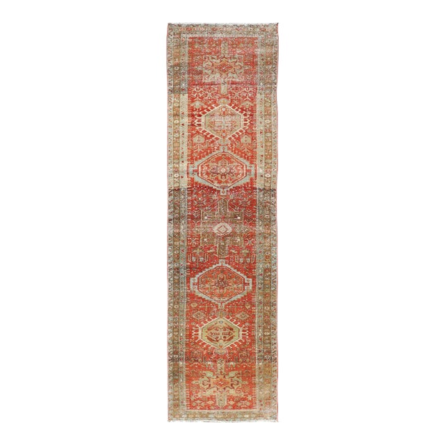 Antique Persian Heriz Distressed Runner With Geometric Medallions in Soft Colors For Sale