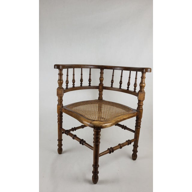 Corner chair, corner armchair / rounded back and honeycomb-shaped cane seat. It is in good condition (seat very slightly...