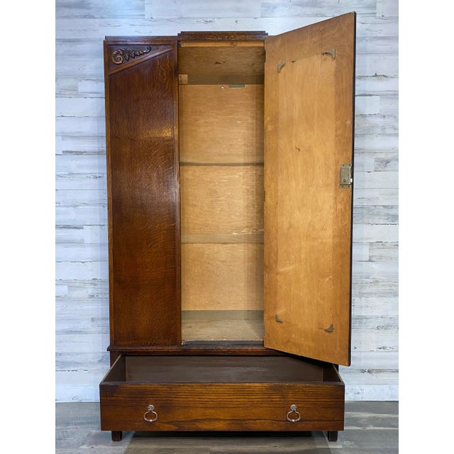 Beautiful wood antique armoire. Has hook inside for hanging clothes. 1 storage drawer. Dovetailed ends. Comes apart in 2...