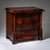 Three-drawer Biedermeier chest of drawers with book-matched mahogany veneer and flanking columns raised on square legs....