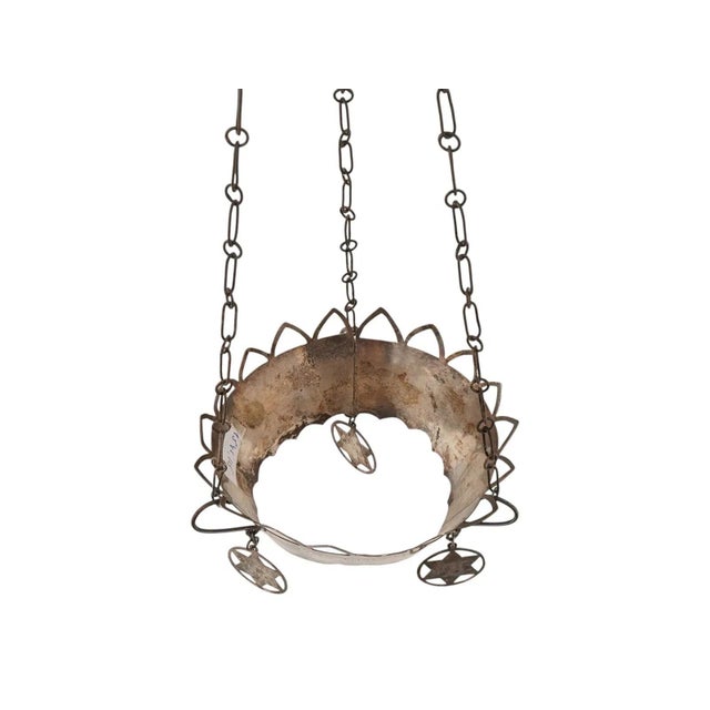 A vintage silver Judaica Ner Tamid perpetual lamp holder. The hanging sanctuary lamp features three suspended Star of...
