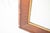 This listing is for a vintage, mid-century wall mirror. It is made of heavy, hard wood with gold trim surrounding the...