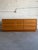 Beautiful Mid Century Modern teak low dresser, featuring a long, clean-lined silhouette with softly rounded edges and...