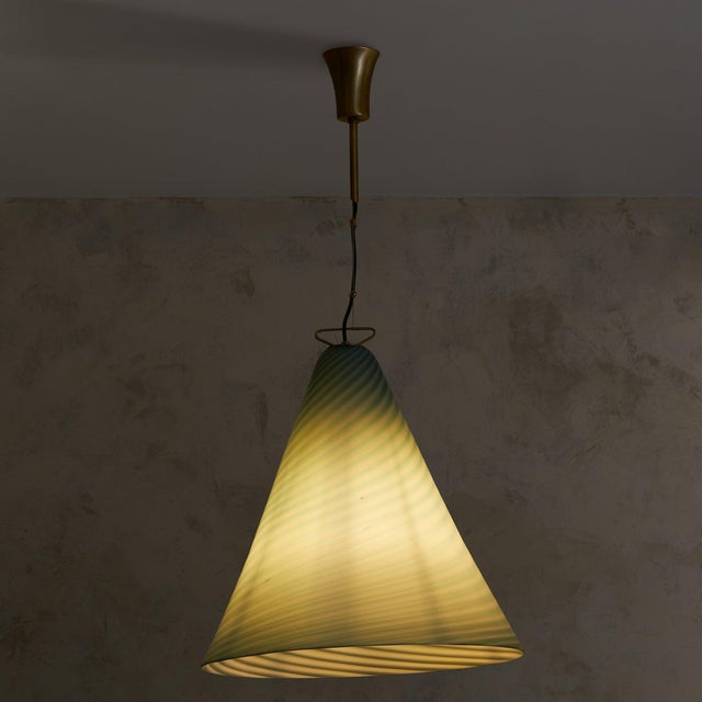 Swirled in delicate ribbons of slate blue, this 1970s Italian pendant light by La Murrina embodies the artistry of Murano...