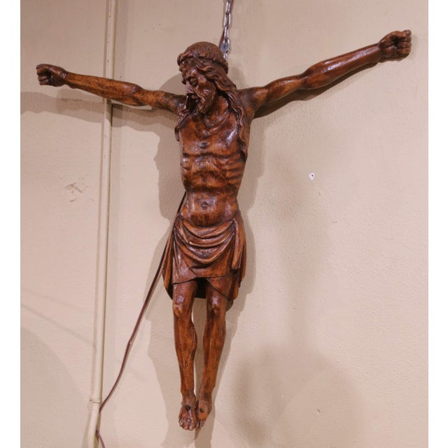 This powerful mid-17th century French crucifix, carved in walnut circa 1650, exemplifies the raw devotional intensity and...