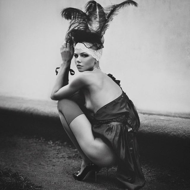 Black Opium by Dasha and Mari A flapper fashioned women crouches nude, 2021. Limited edition print (edition size 1/30)...