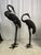 A pair of large bronze oriental cranes. A symbol of longevity and wisdom in oriental mythology, the crane is also...