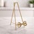 Showcase your favorite plates, framed photos, or decorative artwork in style with this Gold Bow Plate Holder Easel....